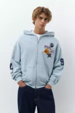Sudadera capucha cremallera parches 1.webp
